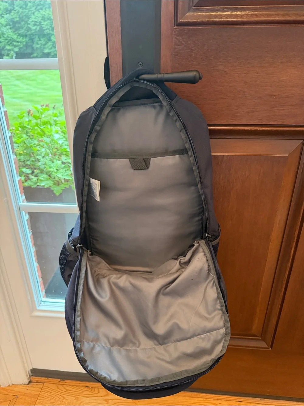 The North Face Navy Blue Backpack with White Bungee Cord